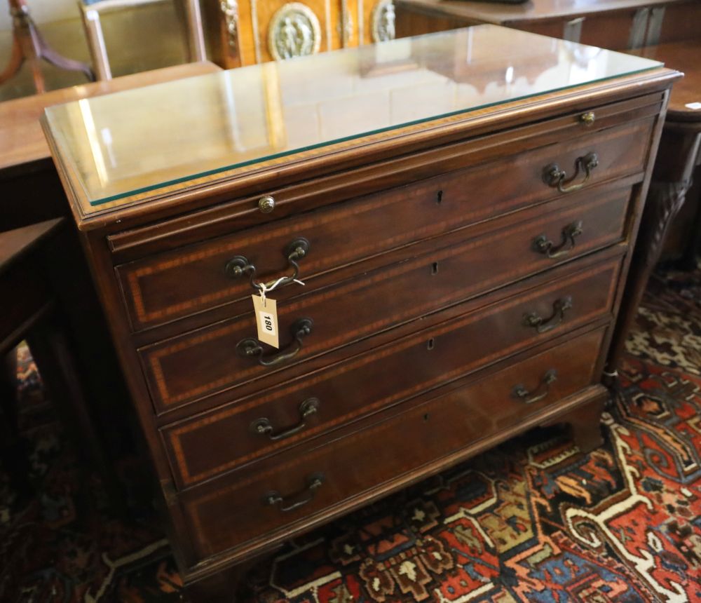 An inlaid mahogany chest fitted four graduated long drawers and brushing slide, width 92cm, depth 44cm, height 84cm